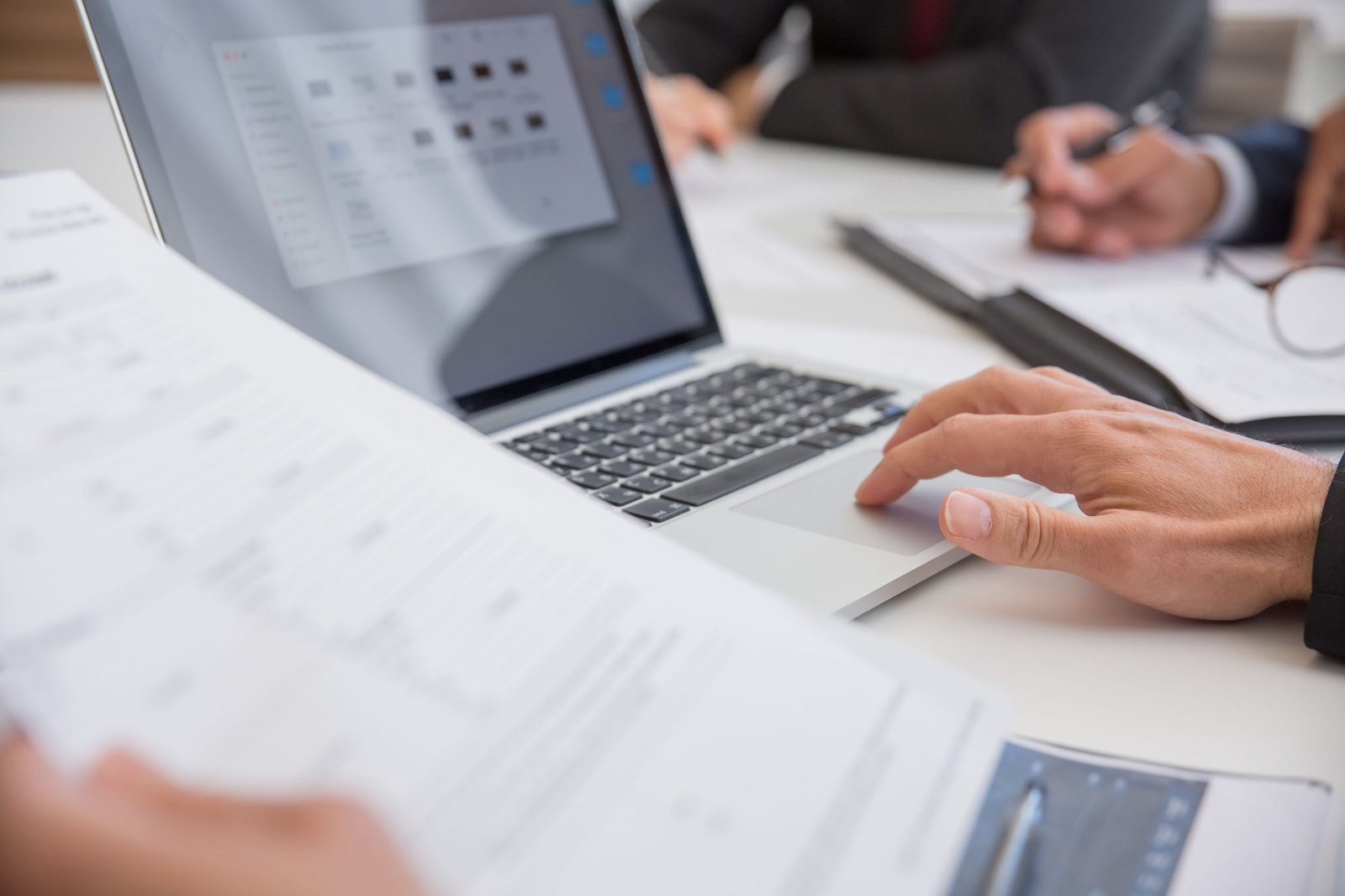 Reviewing business records at a laptop