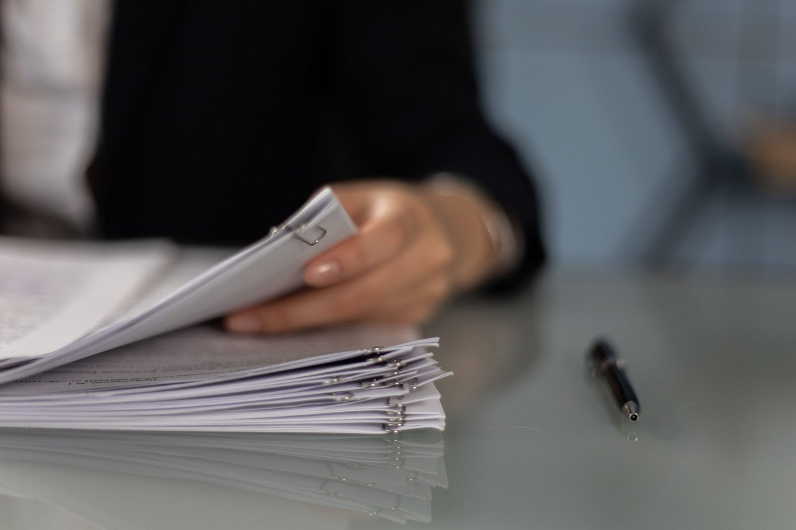 Stack of clipped financial documents
